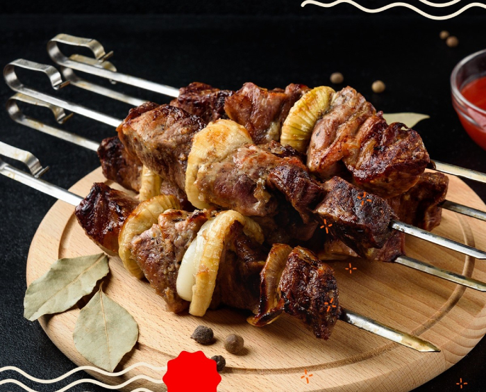 Shashlik kebabs from Darin's in Edinburgh with grilled meat and onions on skewers.